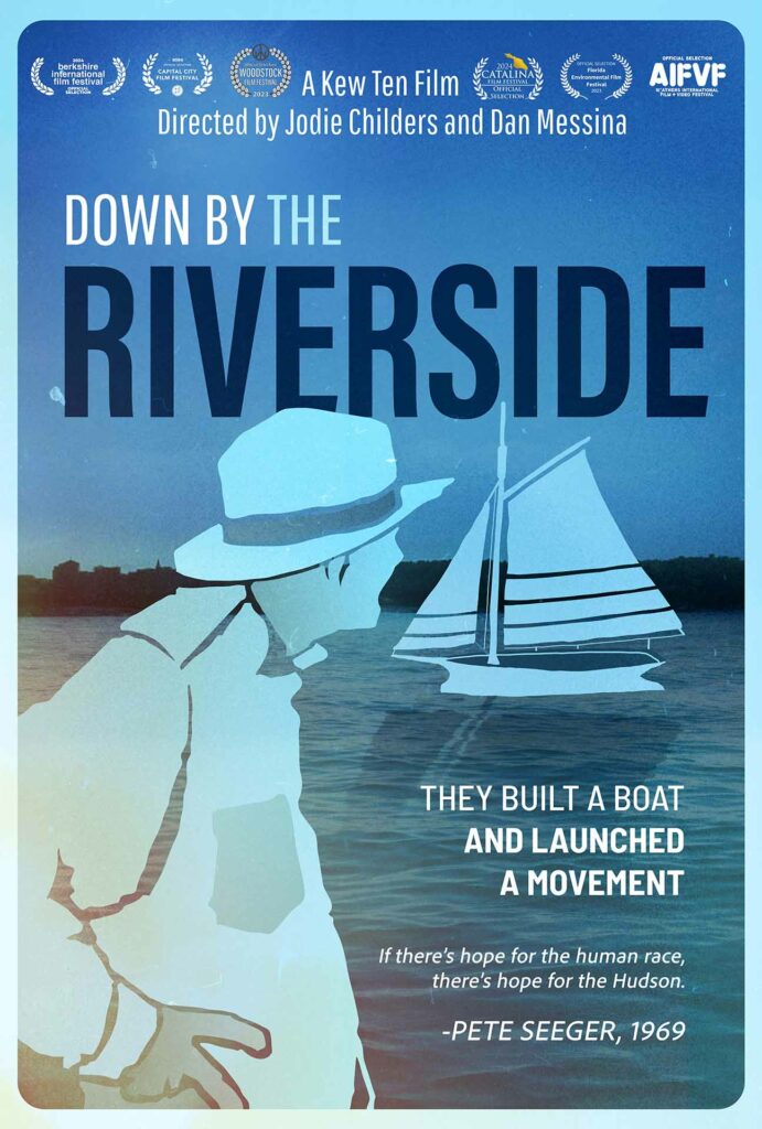 A poster for the Film Down by the Riverside, consisting of a photo of the Hudson River with illustrations of the sloop Clearwater and Pete Seeger overlaid. Along the top, the title appears along with the laurels for the film festivals at which the documentary has shown.